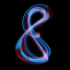 The neon number 8, blue light image, long exposure with colored fairy lights, against a black background