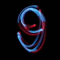 The neon number 9, blue light image, long exposure with colored fairy lights, against a black background