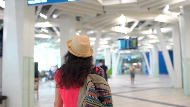 Female traveler woman with baggage walking in airport terminal. travel tourism baggage departure destination business tourist girl passenger arrivals departures weekend vacation holiday, slow-motion