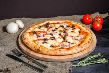 Vegetarian homemade Mushroom pizza with cheese and tomatoes