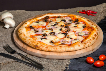 Vegetarian homemade Mushroom pizza with cheese and tomatoes