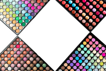 Colorful make-up eyeshadow palettes isolated on a white background