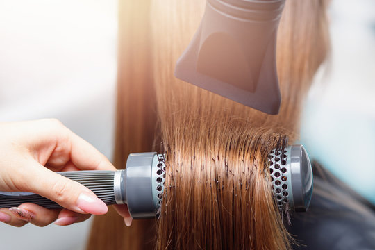 Close-up blow drying for brushing. Salon Spa treatment of keratin straightening and restoration