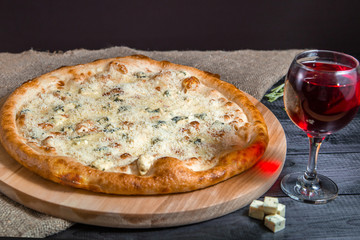 Four Cheese Pizza, mozzarella, cheddar, cream on a black background