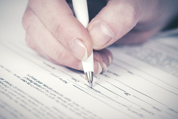 Business woman signing contract