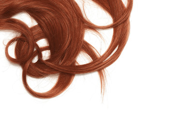 A strands of long, twisted, henna hair isolated on white background