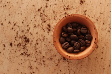 clay cup and coffee beans
