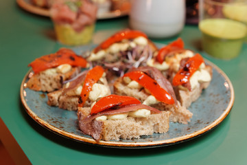 Tapas with anchovies and guacamole