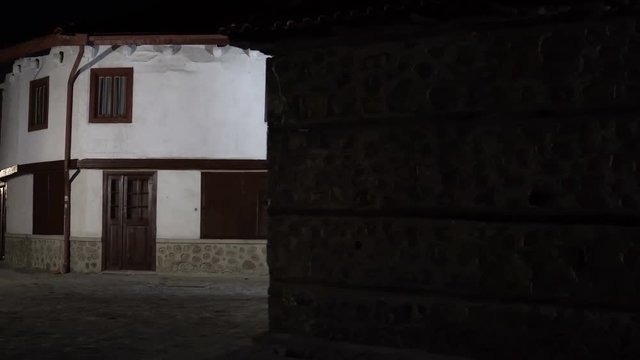 Establishment shot of Vintage dark alley and old traditional house in Bansko, Bulgaria. Bansko is most famous ski recreation centre in Bulgaria and Balcan peninsula