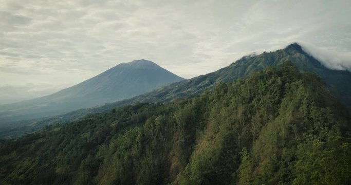 edited drone footage at sunrise over caldera of Bali's Batur volcano