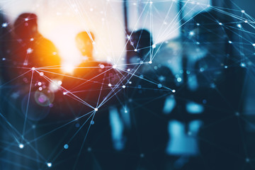 Silhouette of business people work together in office. Concept of teamwork and partnership. double exposure with network effects