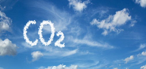 CO2 inscription painted with clouds on a blue background with white clouds