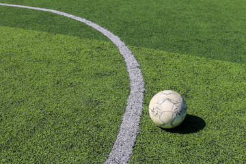 Football on artificial turf. It is for green background in a stadium