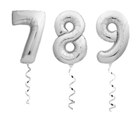 Silver numbers 7, 8, 9 made of inflatable balloons with ribbons isolated on white background