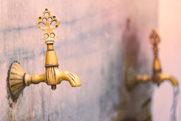 Two old public taps in Istanbul, Turkey