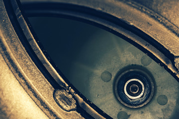 Unusual robotic eye in steampunk style in faded tones. Focused robot look. Golden background...