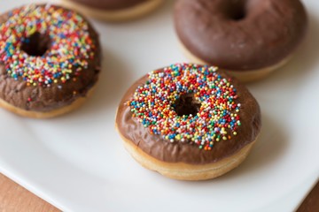 donuts isolated on white plate