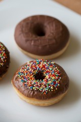 donuts isolated on white plate