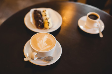 A mug of fragrant cappuccino brought by the waiter