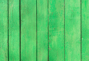 Fototapeta na wymiar green old wooden fence. wood palisade background. planks texture