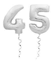 Silver chrome forty five 45 made of inflatable balloon with ribbon on white