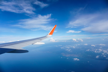 Fototapeta premium High Altitude over Crimea and the Clouds from a Plane Window