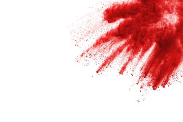 Freeze motion of red powder exploding, isolated on white background. Abstract design of red dust cloud. Particles explosion screen saver, wallpaper