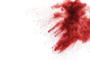 Freeze motion of red powder exploding, isolated on white background. Abstract design of red dust cloud. Particles explosion screen saver, wallpaper
