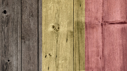 Naklejka premium Belgium Politics News Concept: Belgian Flag Wooden Fence