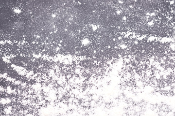 photo texture gray background with scattered flour, blurred