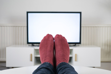 Feet up in front of TV with a blank screen