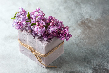 Natural handmade soap and lilac flowers.