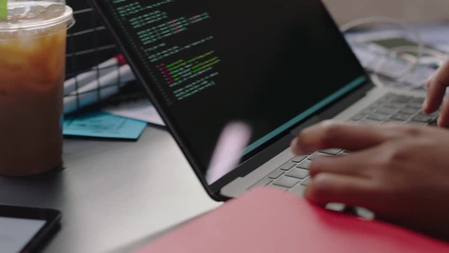 close up hands engineers developing software app using digital laptop computer typing code on screen programmers coding internet security system designing artificial intelligence project in office