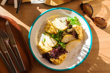Top view on a plate with a wholesome fresh salad.