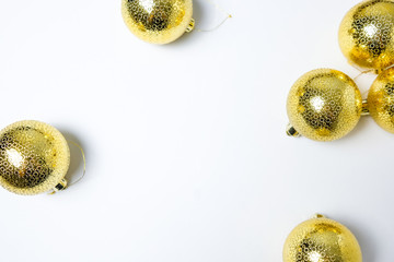 Christmas or New Year composition with golden balls on white background. Flat lay, top view with space for text with space for text