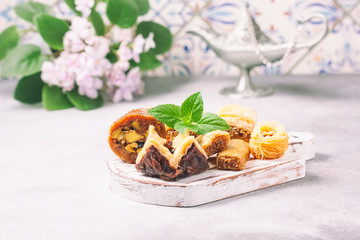 Traditional arabic dessert Baklava with honey and nuts, selective focus