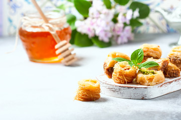 Traditional arabic dessert Baklava with honey and nuts, selective focus