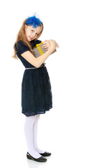 Cute little girl with a gift in hand.