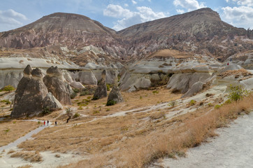 Fairy Chimneys (Pasabagi) rock formations and mountain cliffs near Zelve, Nevsehir Province, Turkey