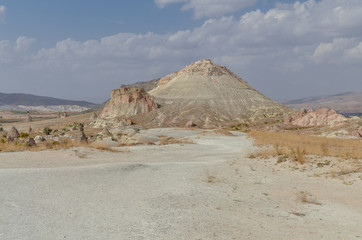 Fototapeta na wymiar sandstone cliffs and rock formations along Zelve Yolu near Cavusin, Nevsehir Province, Turkey