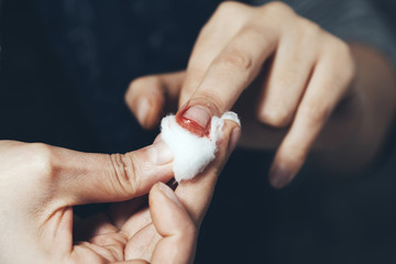 bloody  finger with cutton