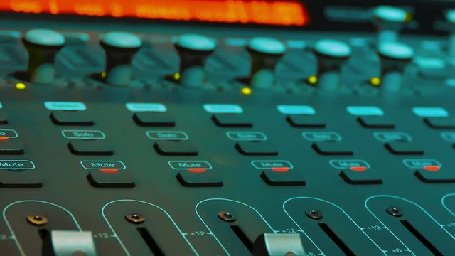 Mixing Music lifestyle audio Concept Studio. music, technology people and equipment concept - happy man at mixing console in sound recording the studio. Remote MIDI control surface