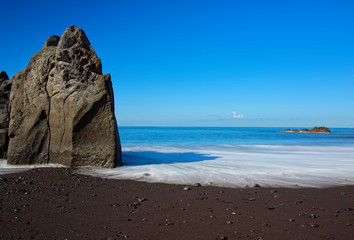 Black sand beach Praia Formosa on Portuguese island of Madeira