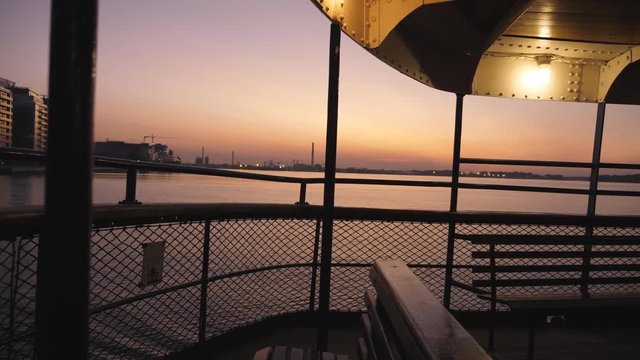 Dawn view of skyline from Toronto islands ferry Sam McBride. Passenger view from summer ferry going from Toronto to Ward's Island.