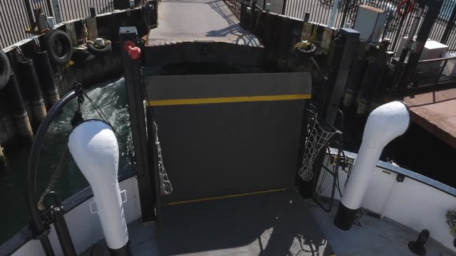 Passenger pov view of the Sam McBride ferry as it leaves Ward's island for the return journey to downtown Toronto, Summer.