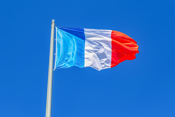 Naklejka na ściany i meble National flag of France waving and blowing in the wind
