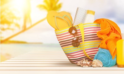 Bag,  flip flops on a tropical beach