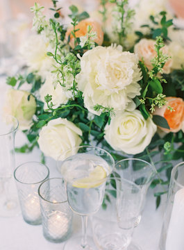 Flowers and stemware at a wedding reception