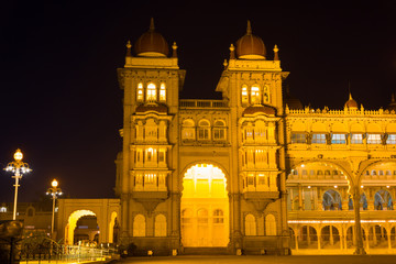 Mysore Palace side entrance lighted up at night. Royal building, architecture landmark in Karnataka, India