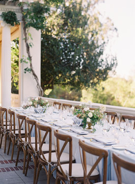 Place settings at an outdoor wedding reception